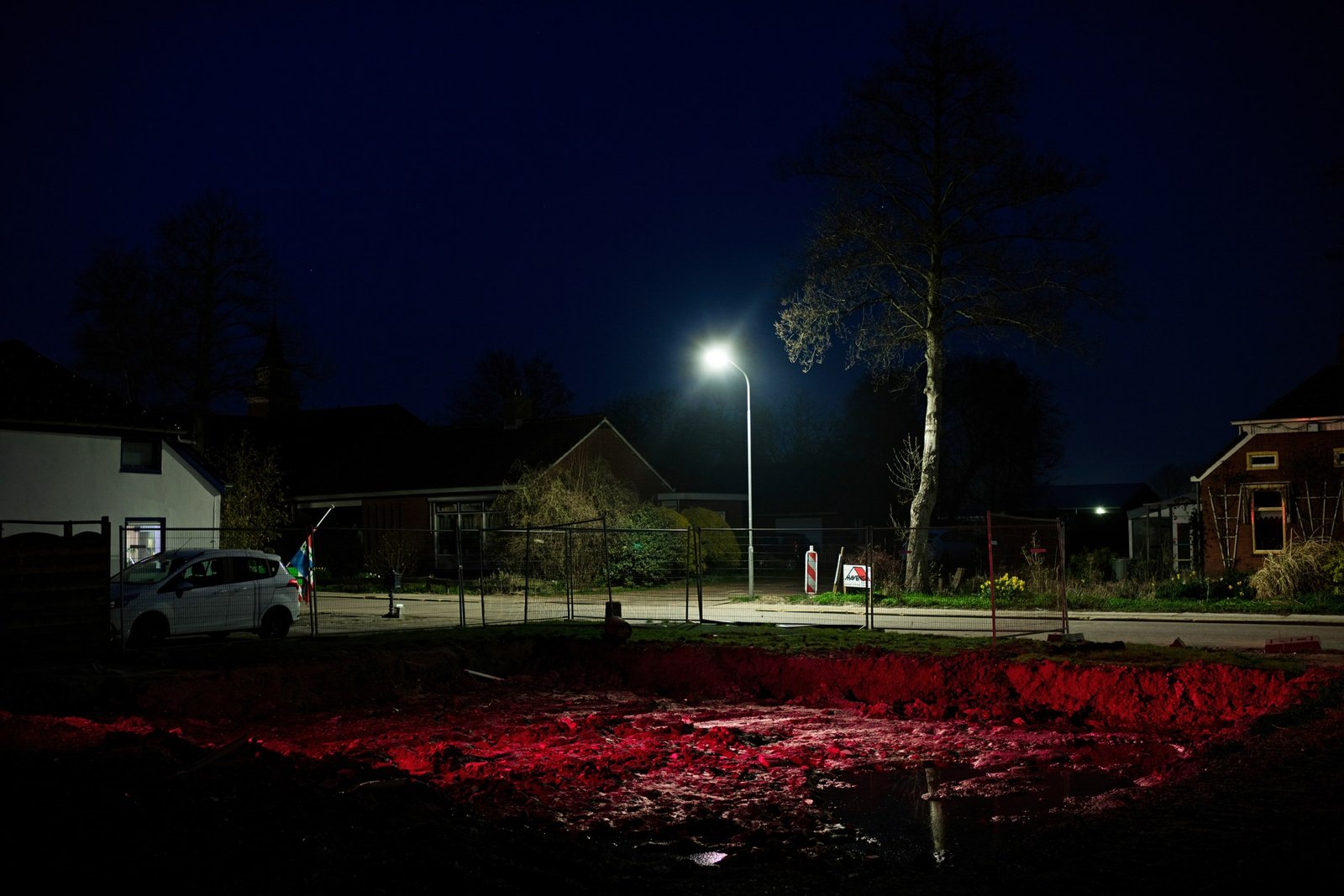 An illuminated street in Overschild at night