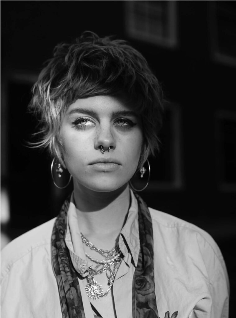 Monochrome portrait with layered necklaces