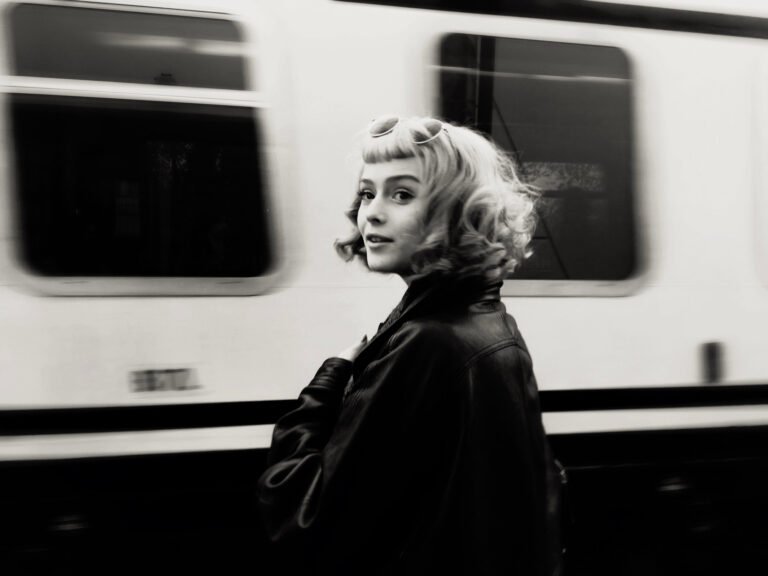 Monochrome portrait beside a passing train